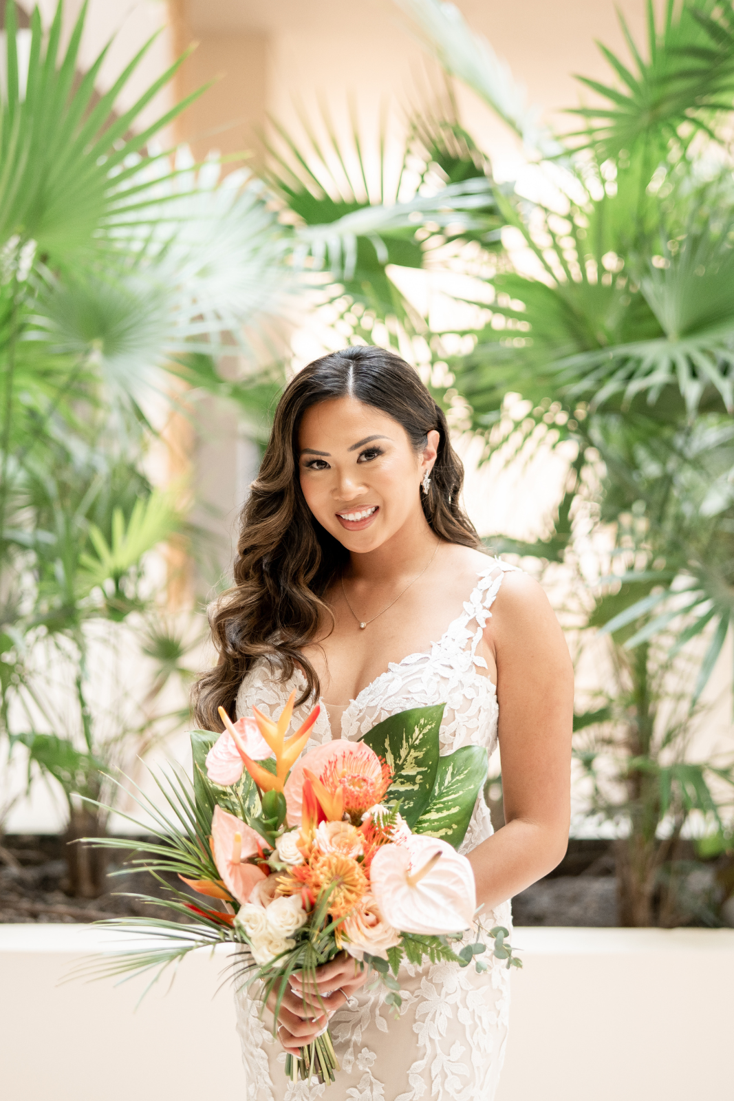 Bride with flowing hair and a tropical bridal bouquet