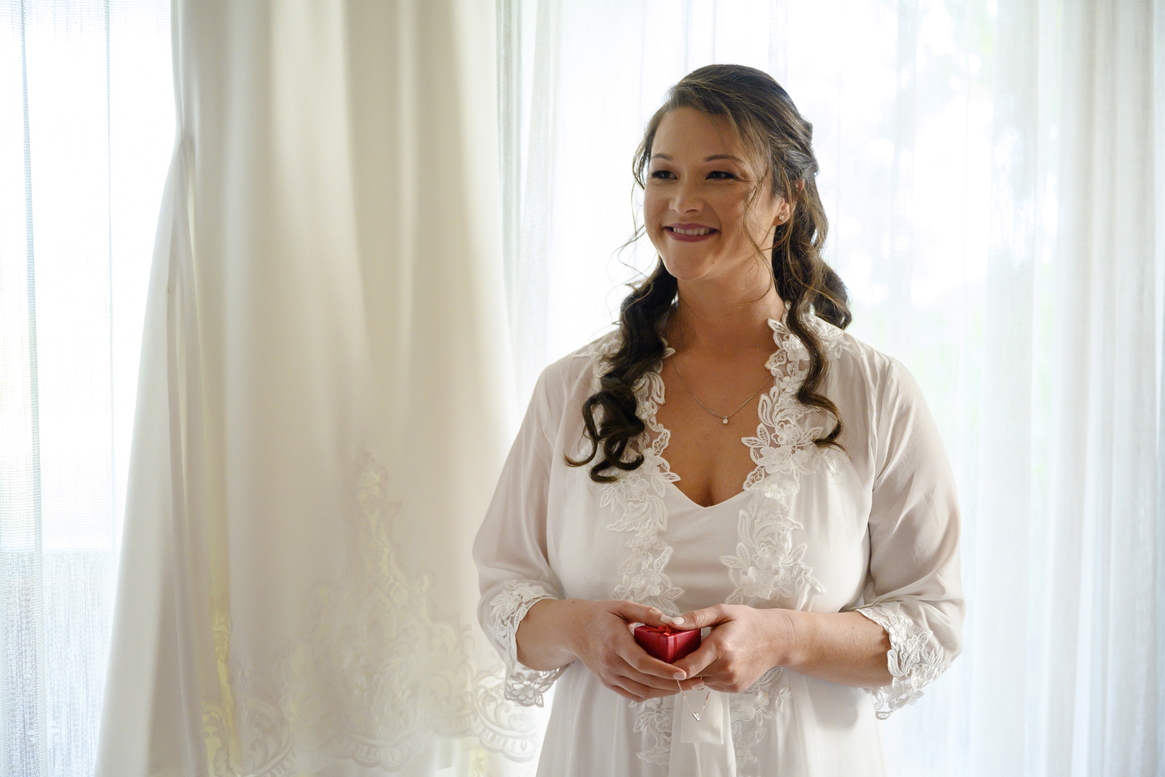 Bride smiling during her wedding morning preparations